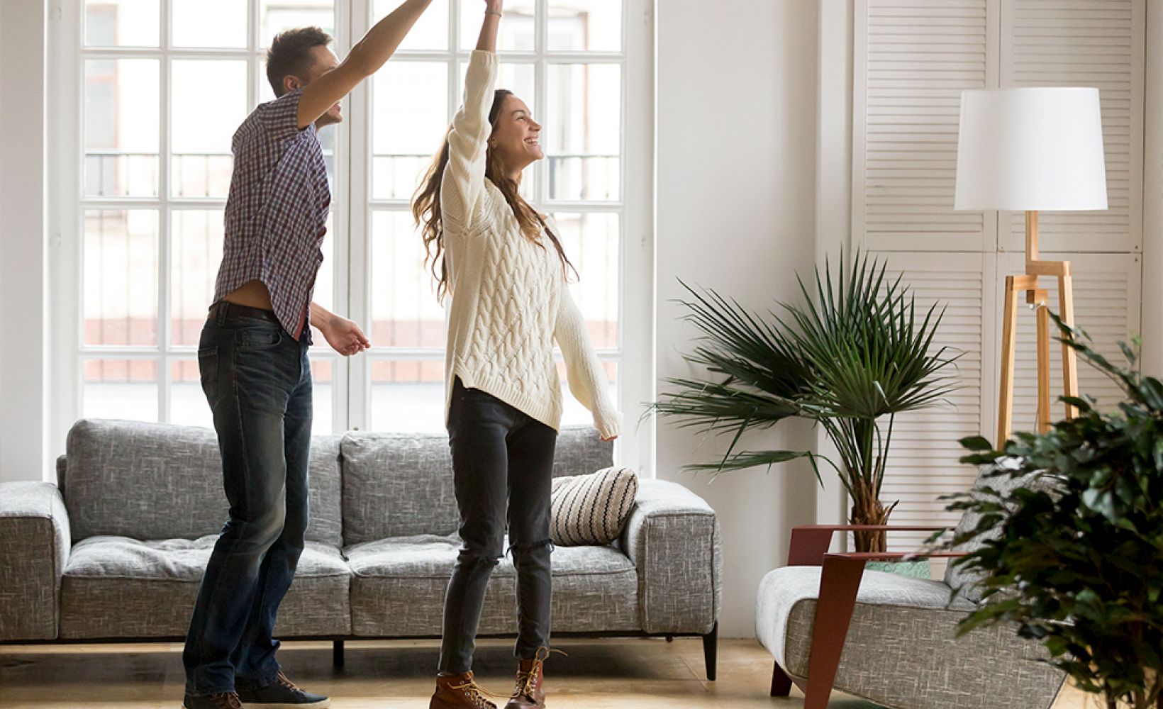 couple dancing together in living room